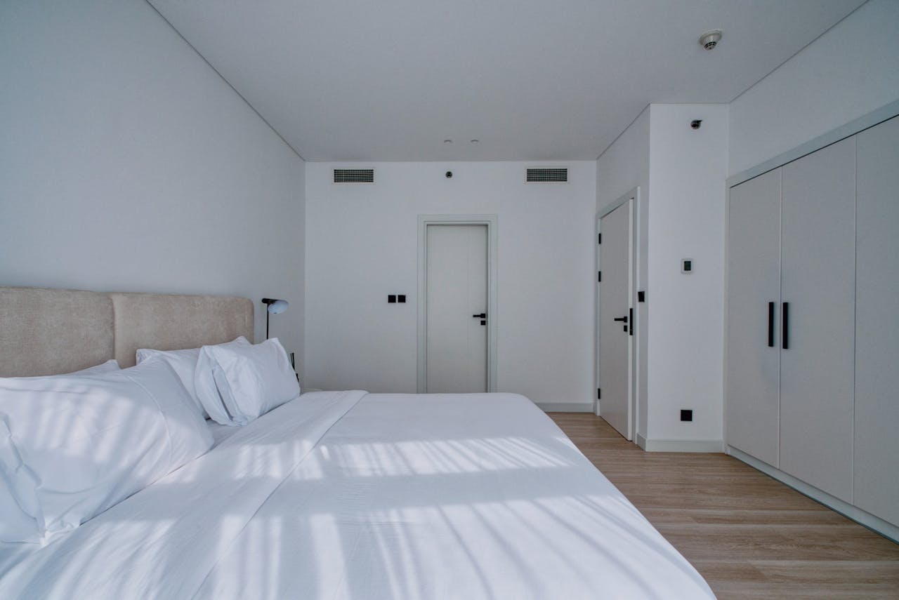 Explore a sleek and neutral modern bedroom, perfect for contemporary living.